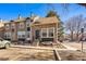 Exterior of a townhome with tidy landscaping, parking space and a small porch at 11542 Community Center Dr # 56, Northglenn, CO 80233