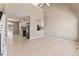 Bright living room featuring hardwood floors, neutral walls, with a view into the kitchen and backyard patio at 11542 Community Center Dr # 56, Northglenn, CO 80233