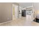 Open-concept layout connects the living room, kitchen and bathroom with modern stainless appliances and natural light at 11542 Community Center Dr # 56, Northglenn, CO 80233