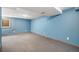 Large basement with neutral carpet and blue painted walls at 8022 W 78Th Way, Arvada, CO 80005