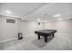 Finished basement features neutral colors and has a pool table at 8022 W 78Th Way, Arvada, CO 80005