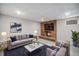 Cozy basement living room with a brick fireplace and comfortable seating at 8022 W 78Th Way, Arvada, CO 80005