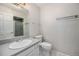 Bathroom featuring a large vanity sink and a walk-in shower with a glass door at 8022 W 78Th Way, Arvada, CO 80005