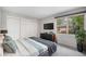 Bedroom featuring large closets, a window, and modern decor at 8022 W 78Th Way, Arvada, CO 80005