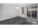Dining area with hardwood floors, natural light, and a modern light fixture at 8022 W 78Th Way, Arvada, CO 80005