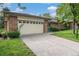 Traditional brick home with an attached two-car garage and well manicured landscaping at 8022 W 78Th Way, Arvada, CO 80005