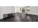 Spacious living room featuring hardwood floors, natural light, and a sliding glass door at 8022 W 78Th Way, Arvada, CO 80005