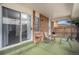 Covered patio with turf, seating and a view inside the home at 8022 W 78Th Way, Arvada, CO 80005