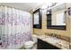 Charming bathroom featuring a shower, modern vanity and floral shower curtain at 9963 E Carolina Cir # 104, Aurora, CO 80247