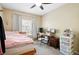 Bright bedroom with neutral walls, carpet and a ceiling fan creates a cozy atmosphere at 9963 E Carolina Cir # 104, Aurora, CO 80247