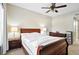 Charming bedroom with wood furniture and two nightstands on either side of the bed at 9963 E Carolina Cir # 104, Aurora, CO 80247