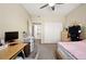 Inviting bedroom with a view to the entry, closet, and en suite bathroom at 9963 E Carolina Cir # 104, Aurora, CO 80247
