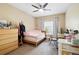 Bedroom with carpeted floors, ceiling fan and window at 9963 E Carolina Cir # 104, Aurora, CO 80247