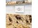 Close-up of granite countertop and white subway tile backsplash at 9963 E Carolina Cir # 104, Aurora, CO 80247