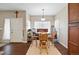 Bright dining area with wood floors has a large window and view of entryway at 9963 E Carolina Cir # 104, Aurora, CO 80247