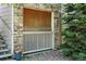 The condo features an exterior privacy screen made of decorative bricks at 9963 E Carolina Cir # 104, Aurora, CO 80247