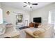 Comfortable living room features sliding glass doors to a balcony at 9963 E Carolina Cir # 104, Aurora, CO 80247