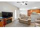 The living room has a neutral decor and open floor plan to the dining area at 9963 E Carolina Cir # 104, Aurora, CO 80247