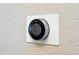 Close-up of Nest thermostat on the wall at 9963 E Carolina Cir # 104, Aurora, CO 80247