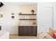 Stylish bar area featuring floating shelves, elegant décor, and a wine fridge at 4238 Zuni St, Denver, CO 80211