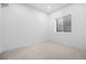 Empty carpeted basement space with a small window at 4238 Zuni St, Denver, CO 80211