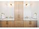 Elegant bathroom with double vanity, quartz countertop, gold fixtures and ample storage space, creating a spa-like retreat at 4238 Zuni St, Denver, CO 80211