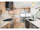 Modern kitchen with stainless steel appliances, light wood cabinets, and sleek countertops at 4238 Zuni St, Denver, CO 80211