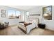 Bright bedroom with a tray with decor, and views from multiple large windows at 4238 Zuni St, Denver, CO 80211