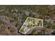 Aerial view showcasing home surrounded by lush greenery and mature trees at 11798 Ridge Rd, Golden, CO 80403