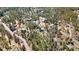 Scenic aerial view showcases homesites nestled in a serene, heavily wooded area providing privacy and natural beauty at 11798 Ridge Rd, Golden, CO 80403