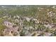 High-angle aerial perspective of residences integrated within a thriving woodland setting with well-maintained roads at 11798 Ridge Rd, Golden, CO 80403