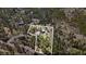 Aerial view showcasing property lines surrounded by lush greenery and mature trees at 11798 Ridge Rd, Golden, CO 80403