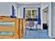 Bright bedroom with carpet floors, bunk beds, a desk, and natural light at 11798 Ridge Rd, Golden, CO 80403