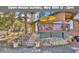 Charming exterior of home with inviting deck and landscaped yard at 11798 Ridge Rd, Golden, CO 80403
