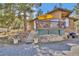 Charming exterior view of home featuring a cozy deck and rock landscaping at 11798 Ridge Rd, Golden, CO 80403