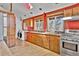 Kitchen features a stainless stove, washing machine, and lots of cabinet space at 11798 Ridge Rd, Golden, CO 80403