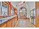 Spacious kitchen with stainless steel appliances, granite countertops, and large arched window at 11798 Ridge Rd, Golden, CO 80403