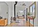 Open-concept living room featuring a wood-burning stove, hardwood floors, and natural light at 11798 Ridge Rd, Golden, CO 80403