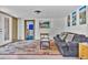 Comfortable living room with carpet floors, sofa, and view into dining area at 11798 Ridge Rd, Golden, CO 80403