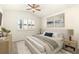 Staged bedroom with a plush bed, stylish nightstands, and serene artwork for a tranquil retreat at 6480 Silver Mesa Dr # B, Highlands Ranch, CO 80130