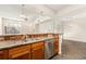 Kitchen featuring stainless steel appliances, and wooden cabinetry with great counter space at 6480 Silver Mesa Dr # B, Highlands Ranch, CO 80130