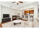 Inviting living room featuring a cozy fireplace and seamlessly connected to the kitchen area at 6480 Silver Mesa Dr # B, Highlands Ranch, CO 80130