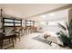 Unique bedroom offers a lounge area with bar seating, a bed, and lots of natural light at 11673 W 28Th Ave, Lakewood, CO 80215
