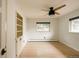 Bright bedroom with hardwood floors, ceiling fan, built-in storage and natural light at 11673 W 28Th Ave, Lakewood, CO 80215