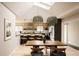 Bright open dining area with modern light fixtures, skylights, and a seamless transition to the kitchen at 11673 W 28Th Ave, Lakewood, CO 80215