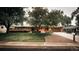 Charming single-story brick home with a well-maintained lawn, mature trees, and an attached garage at 11673 W 28Th Ave, Lakewood, CO 80215