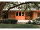 Charming brick home with orange accent bay window, mature tree, and cozy curb appeal at 11673 W 28Th Ave, Lakewood, CO 80215