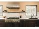 Updated kitchen featuring stainless steel appliances, modern finishes, and a large window for natural light at 11673 W 28Th Ave, Lakewood, CO 80215