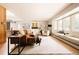 Open concept living room featuring hardwood floors, large bay window, and modern furnishings at 11673 W 28Th Ave, Lakewood, CO 80215