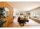 Bright and airy living room with hardwood floors, large bay window, and stylish decor at 11673 W 28Th Ave, Lakewood, CO 80215